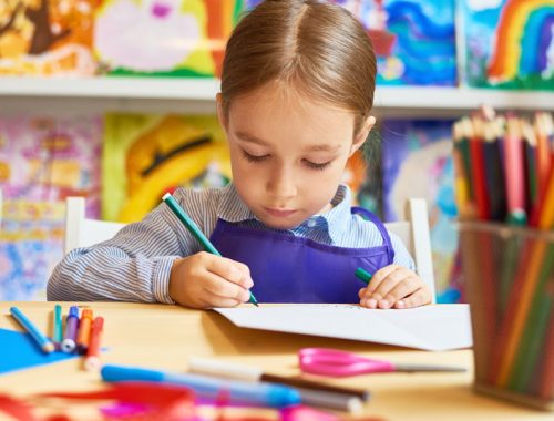 little-girl-drawing-in-pre-school-HQEMYWC.jpg
